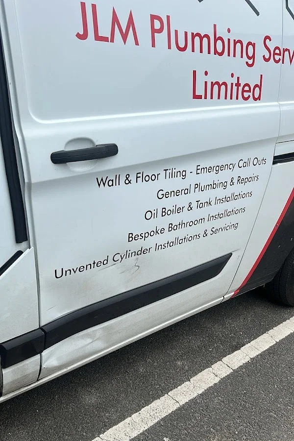 White work van door before repair, with the dent circled in red, shared by Jack Miller