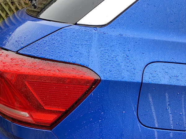 Blue car rear quarter panel after repair, shared by Jan Babycakes