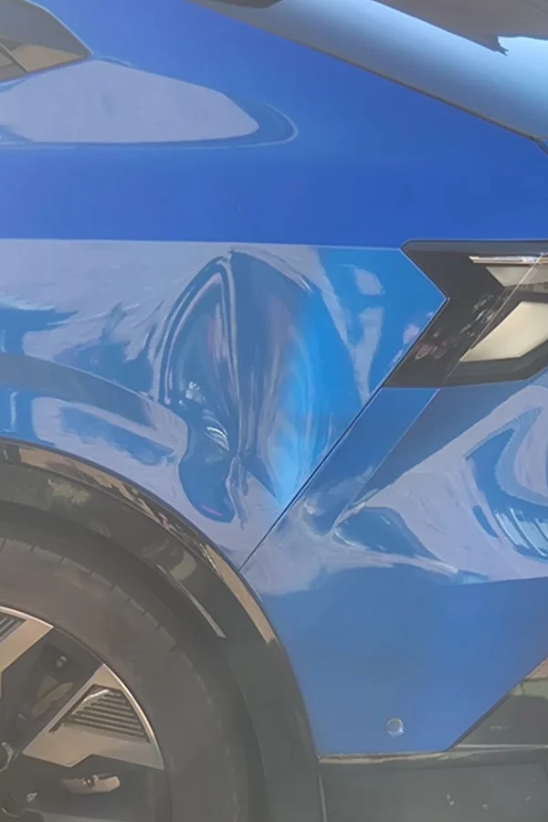 Blue car rear panel before repair, shared by Simon Williams
